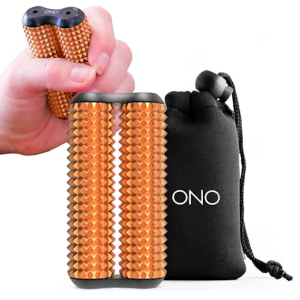A metallic copper or rose-gold handheld fidget roller standing upright next to its matching black drawstring storage pouch, which features the word "ONO" printed in white. In the upper-left corner, a hand demonstrates how the device is held, showing the two parallel cylindrical rollers covered in dozens of small, pointed acupressure pyramids designed for tactile sensory feedback.